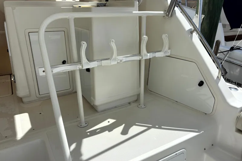 Slide: The Image of 1993 Tiara Yachts 43 Open cockpit with rod holders and storage compartments. - 8