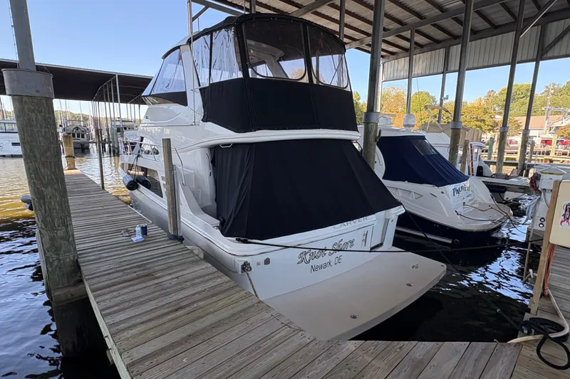 Slide: The Image of 2007 Carver 42 Super Sport yacht docked in marina under shelter. - 1