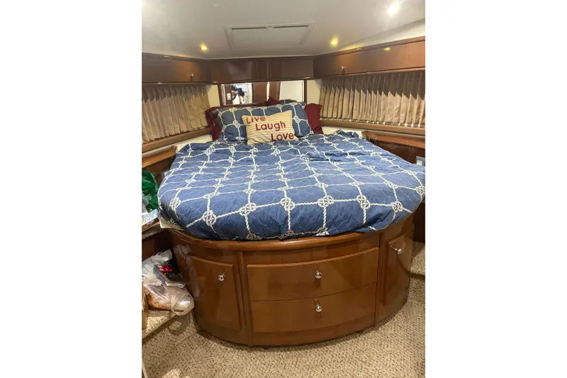 Slide: The Image of Luxurious bedroom interior of 2007 Carver 42 Super Sport yacht with cozy bedding. - 10