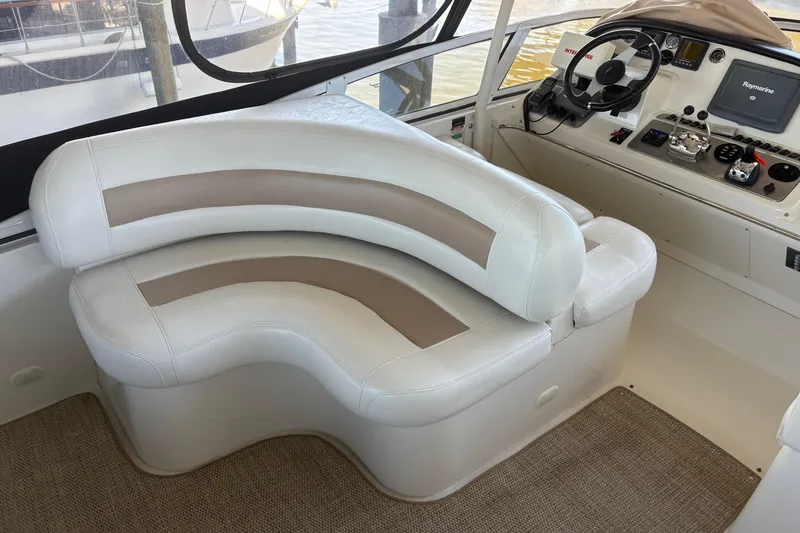 Slide: The Image of Luxurious interior of 2007 Carver 42 Super Sport yacht with plush seating and modern helm. - 19