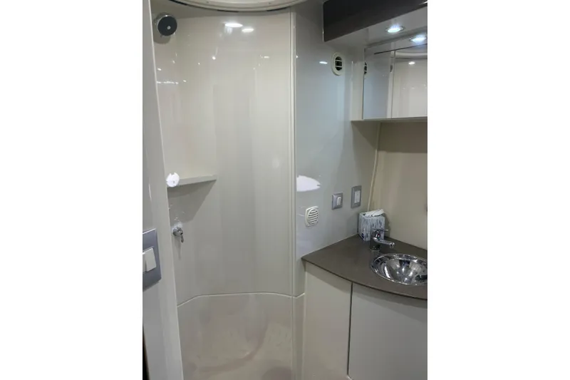 Slide: The Image of 2007 Carver 42 Super Sport yacht bathroom with modern fixtures and sleek design. - 7