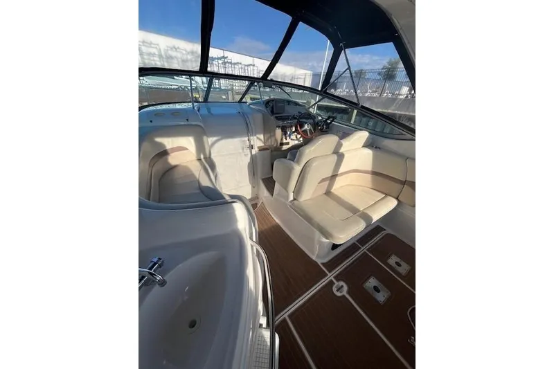 Slide: The Image of 2005 Chaparral 290 Signature boat interior with seating and steering wheel. - 14