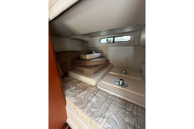 Slide: The Image of Interior cabin of 2005 Chaparral 290 Signature boat with cushions and window. - 21