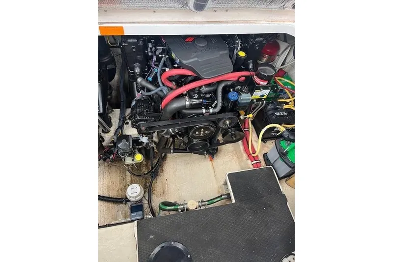 Slide: The Image of Engine compartment of a 2005 Chaparral 290 Signature boat, showcasing mechanical components. - 27