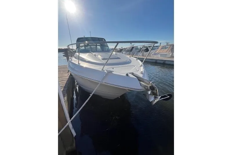 Slide: The Image of 2005 Chaparral 290 Signature boat docked under clear blue sky. - 4