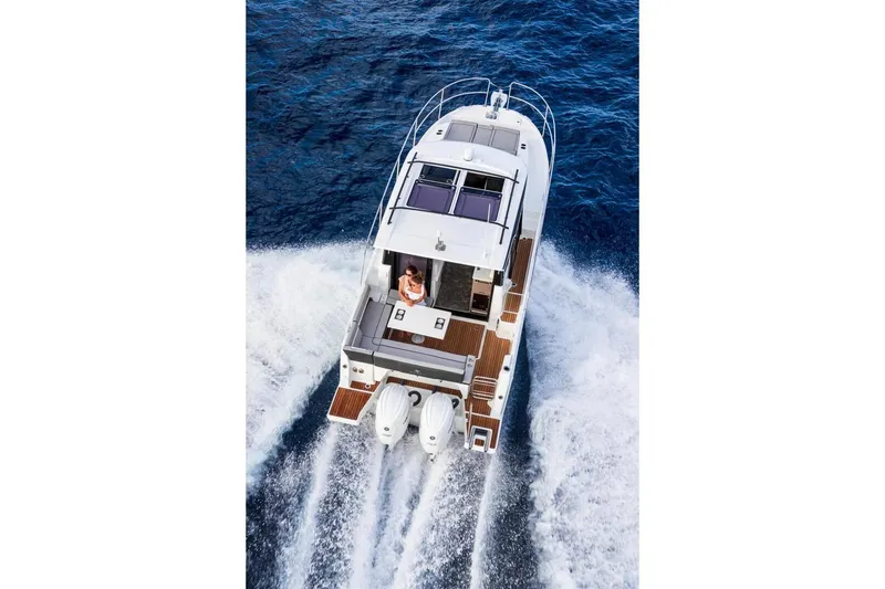 Slide: The Image of 2026 Jeanneau NC 895 Series 2 cruising on open water, aerial view. - 5