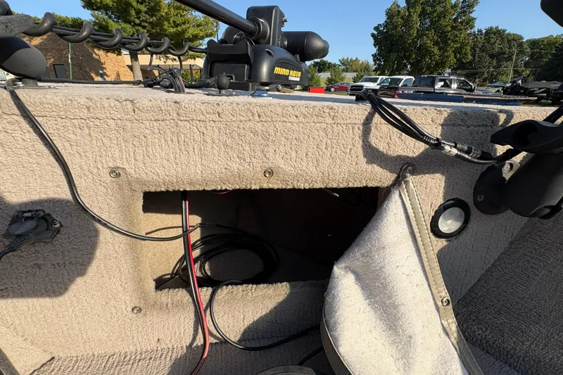 Slide: The Image of 2004 Lund 1800 Explorer SS boat interior with exposed wiring and equipment. - 10