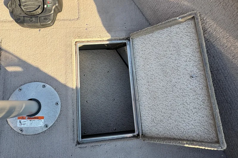 Slide: The Image of Open storage compartment on 2004 Lund 1800 Explorer SS boat deck. - 12