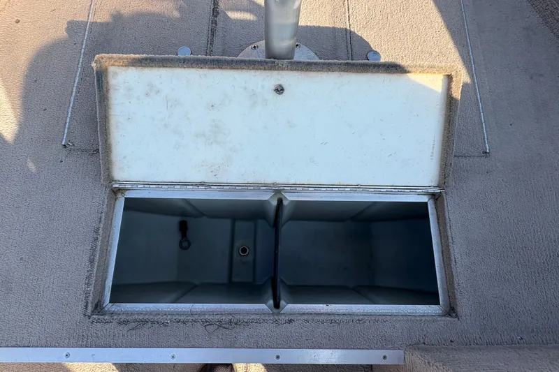 Slide: The Image of Open storage compartment on 2004 Lund 1800 Explorer SS boat deck. - 13