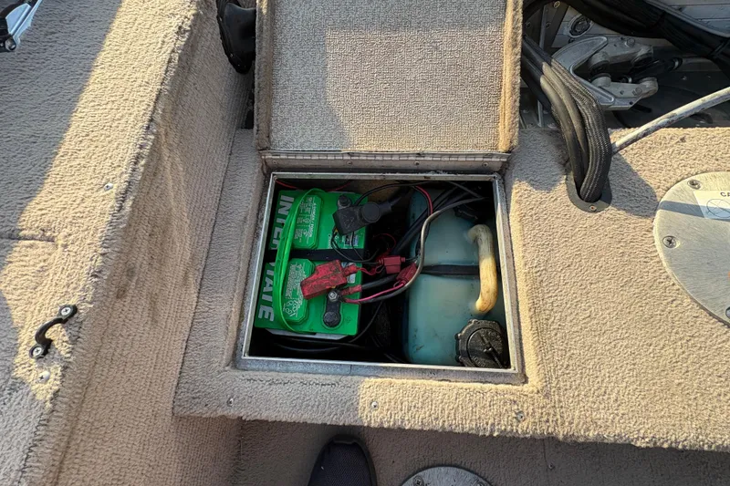 Slide: The Image of 2004 Lund 1800 Explorer SS boat battery compartment with Interstate battery and wiring. - 25