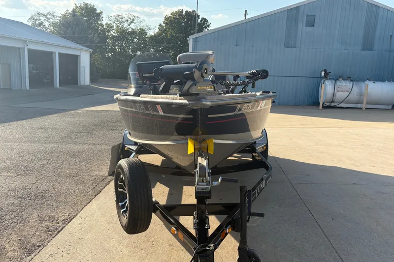 Slide: The Image of 2004 Lund 1800 Explorer SS boat on trailer in sunny outdoor setting. - 6