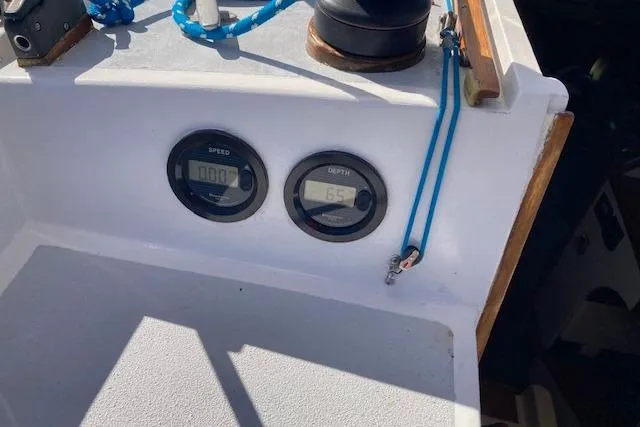 Slide: The Image of Dashboard of 1975 Tartan 41 sailboat with speed and depth gauges. - 10