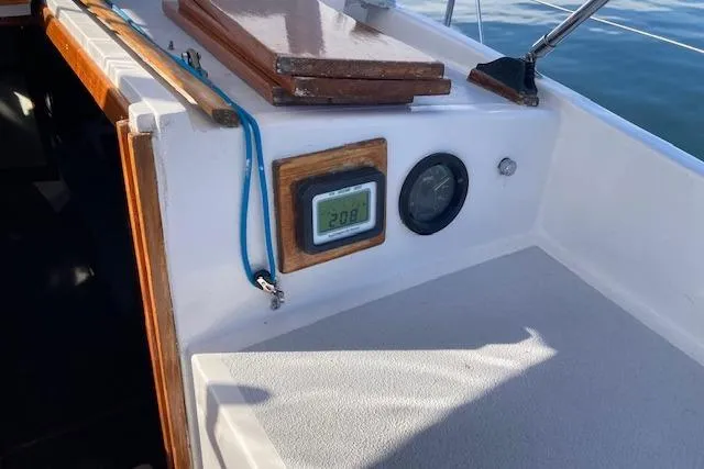 Slide: The Image of 1975 Tartan 41 sailboat cockpit with digital display and wooden accents. - 11