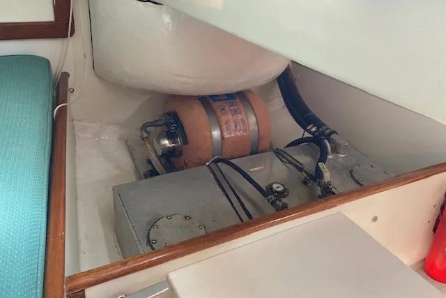 Slide: The Image of 1975 Tartan 41 yacht interior showing engine compartment and components. - 19