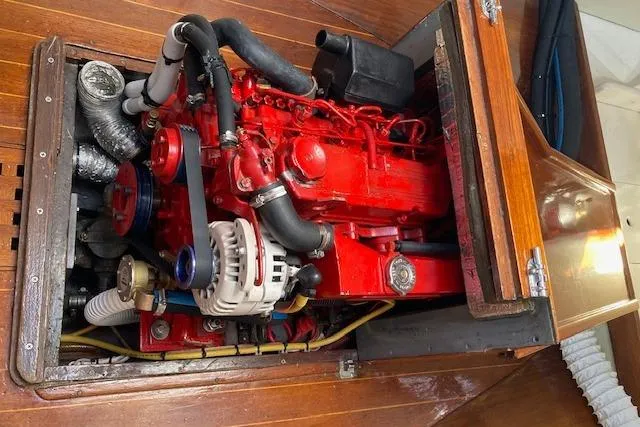 Slide: The Image of Engine compartment of a 1975 Tartan 41 sailboat with a red engine. - 22