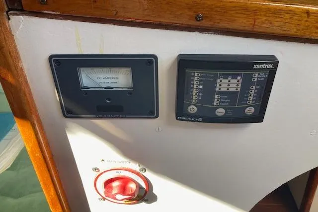 Slide: The Image of Control panel on a 1975 Tartan 41 sailboat with gauges and switches. - 26