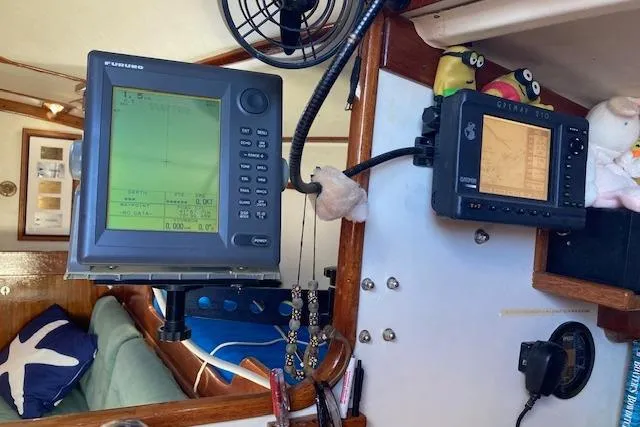 Slide: The Image of Navigation equipment inside a 1975 Tartan 41 sailboat cabin. - 28