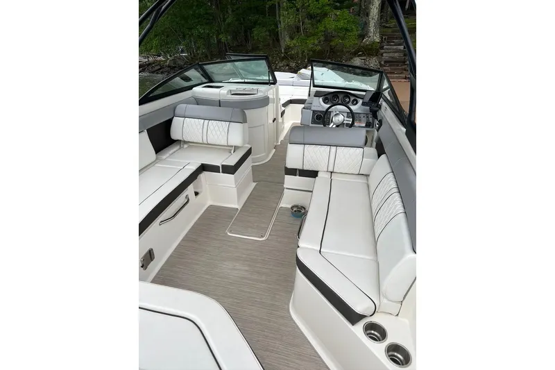 Slide: The Image of 2016 Sea Ray 270 Sundeck interior with luxurious seating and modern dashboard. - 2
