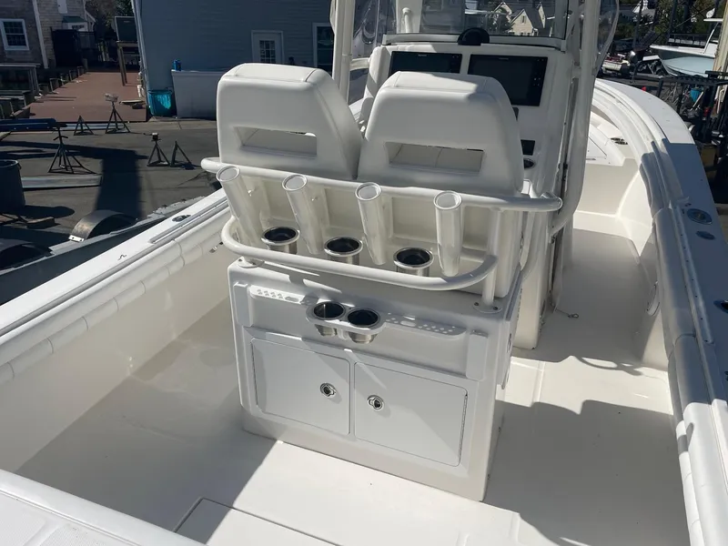 Slide: The Image of 2019 Regulator 23 boat interior with dual seats and storage compartments. - 8