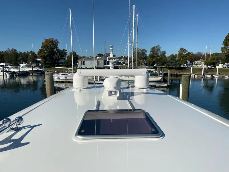 Slide: The Image of 2019 Sabre 45 Salon Express yacht docked, rear view with American flag. - 10