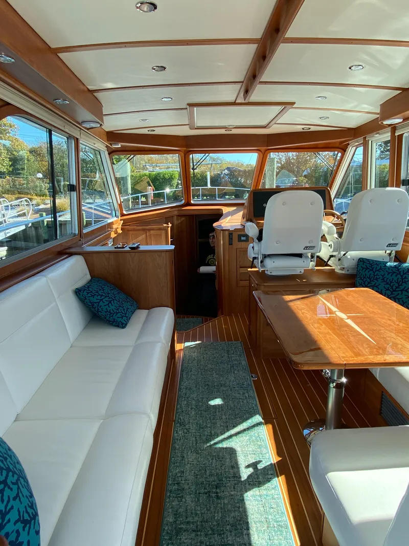 Slide: The Image of 2019 Sabre 45 Salon Express boat compartment with hose and fittings. - 15