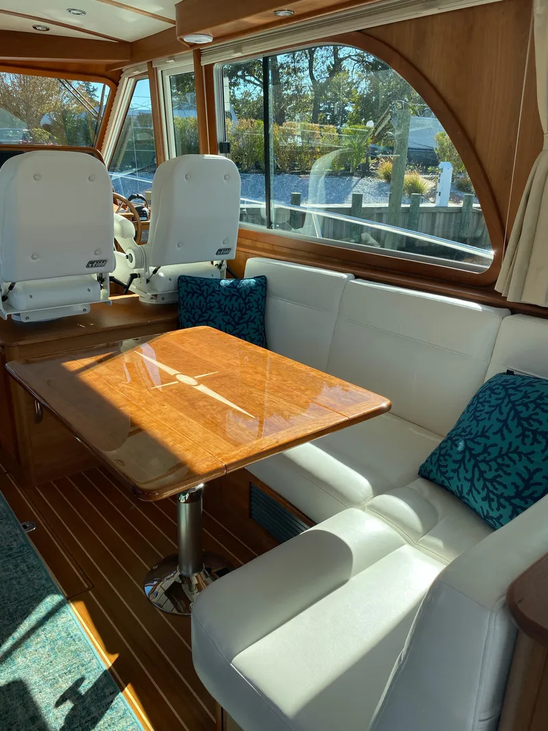 Slide: The Image of 2019 Sabre 45 Salon Express yacht under covered dock, top view. - 18
