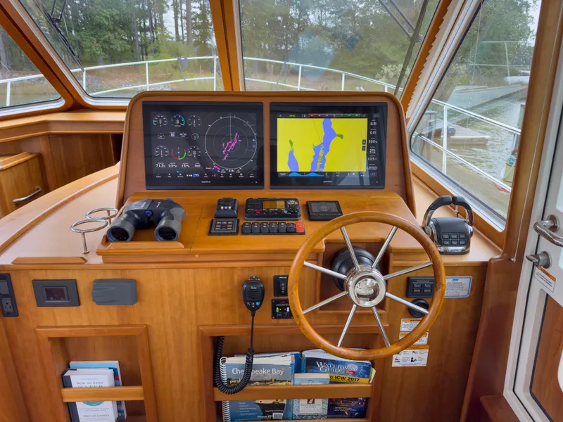 Slide: The Image of 2019 Sabre 45 Salon Express helm with Garmin displays and luxurious seating. - 21