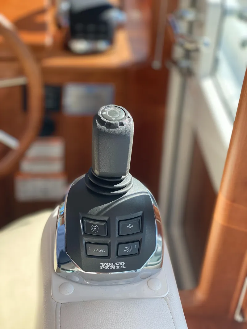 Slide: The Image of 2019 Sabre 45 Salon Express helm with dual navigation screens and control panel. - 25