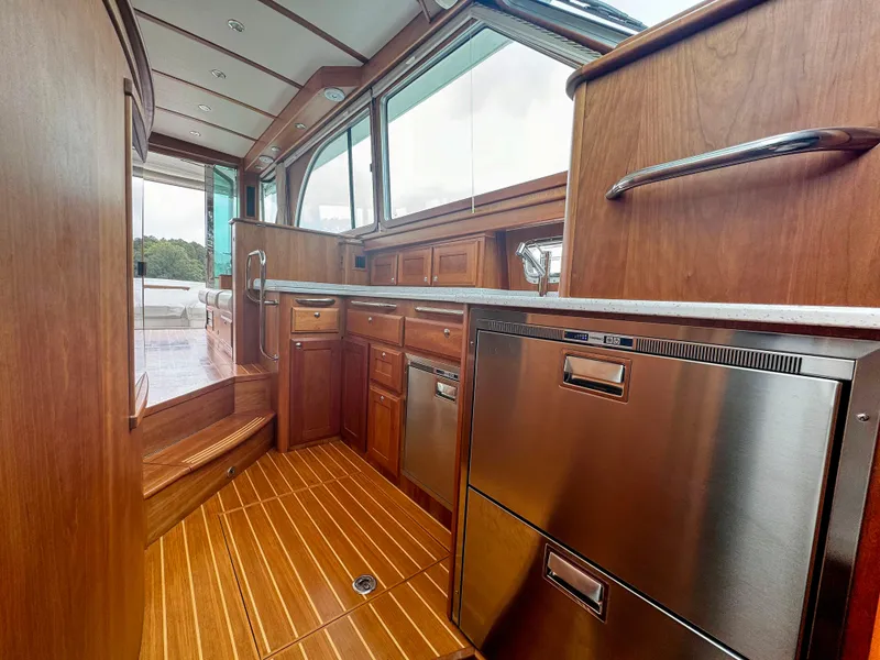 Slide: The Image of Interior of 2019 Sabre 45 Salon Express yacht with elegant seating and wood finishes. - 30
