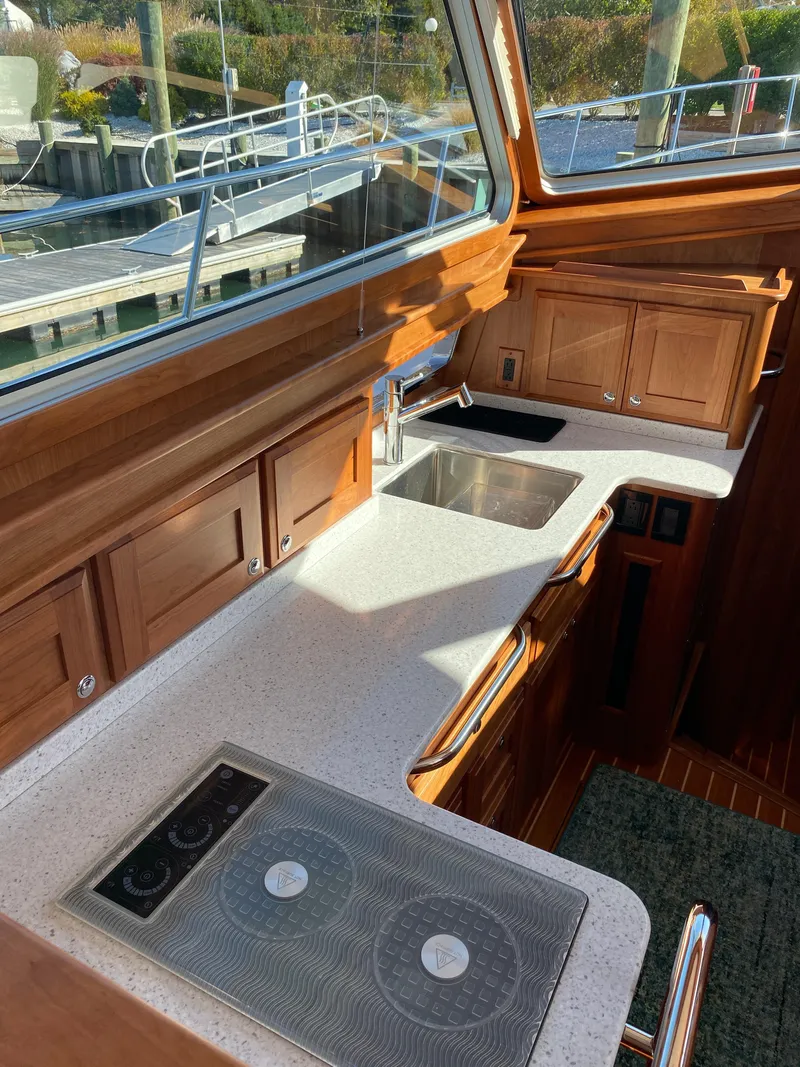 Slide: The Image of Interior of 2019 Sabre 45 Salon Express yacht with luxurious wood finish and modern amenities. - 32