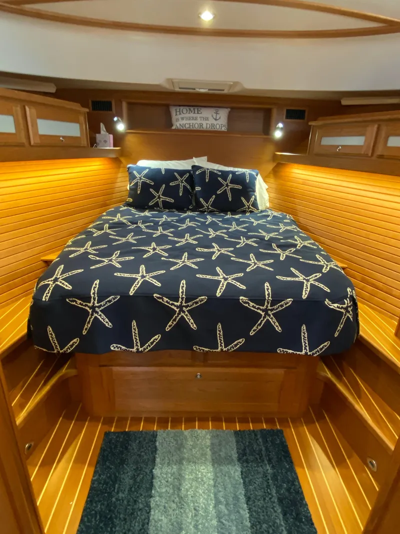 Slide: The Image of 2019 Sabre 45 Salon Express bathroom with modern sink and wooden cabinetry. - 40