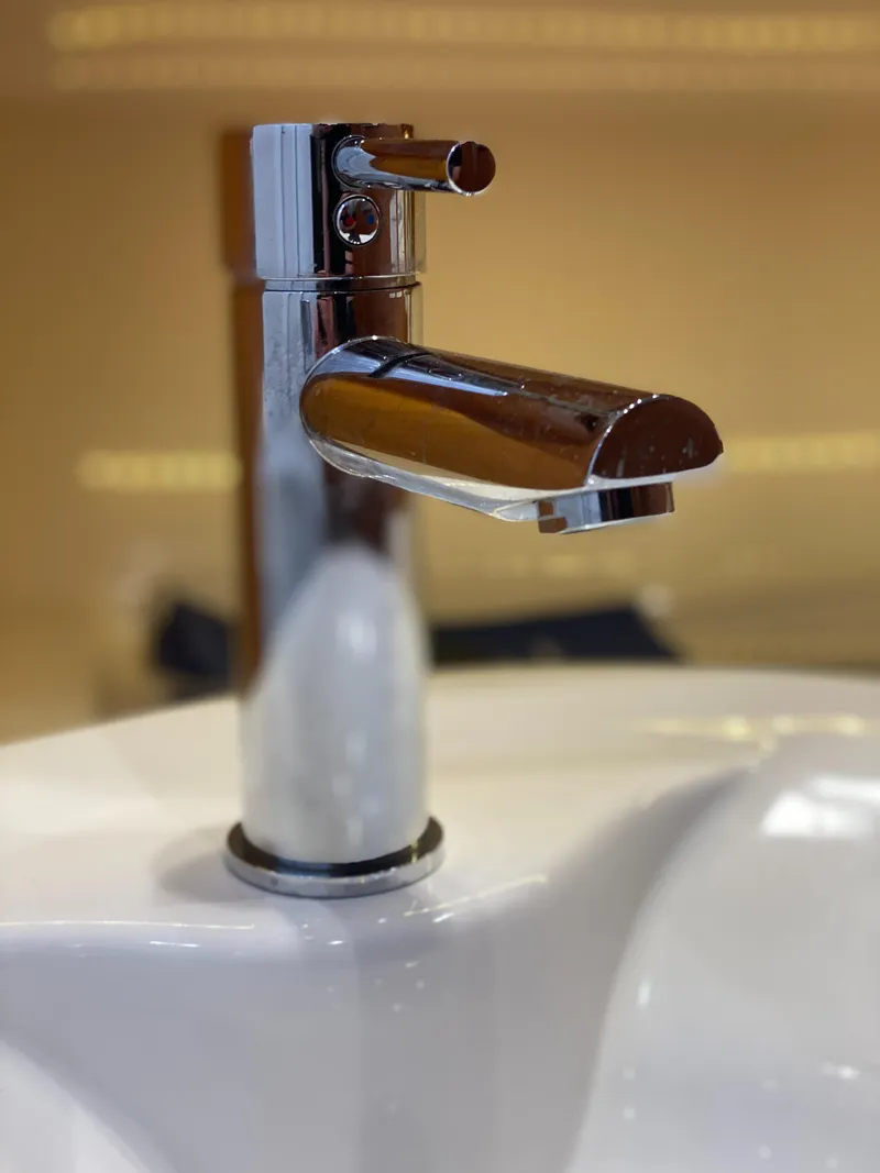 Slide: The Image of 2019 Sabre 45 Salon Express cabin with starfish-themed bedding and warm wood paneling. - 45