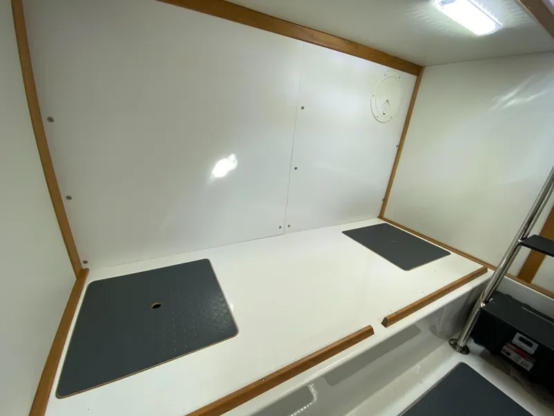 Slide: The Image of 2019 Sabre 45 Salon Express bathroom with wooden cabinetry and modern fixtures. - 49