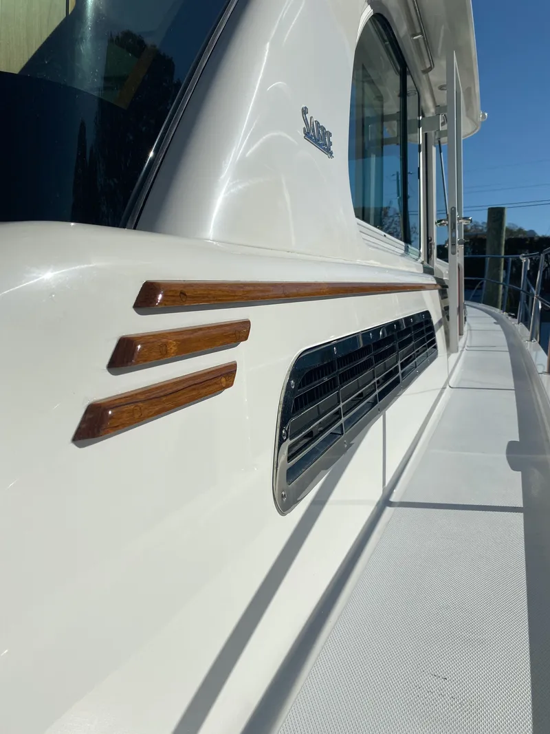 Slide: The Image of 2019 Sabre 45 Salon Express yacht docked under a covered marina. - 5