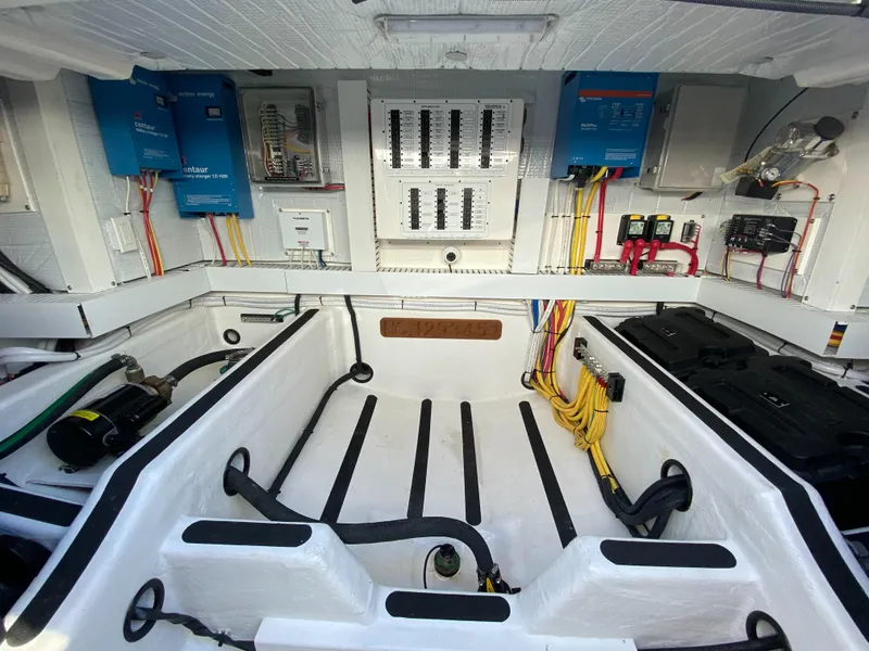 Slide: The Image of Interior of 2019 Sabre 45 Salon Express, featuring sleek white surfaces and wooden accents. - 54