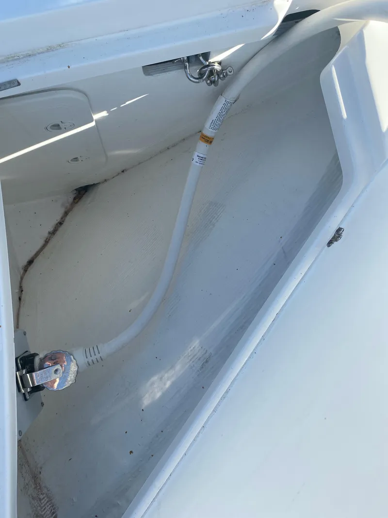 Slide: The Image of 2019 Sabre 45 Salon Express yacht with outdoor seating and wooden deck. - 9