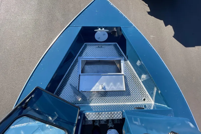 Slide: The Image of 2026 Hewescraft 210 Sea Runner ET boat deck with storage compartment. - 29