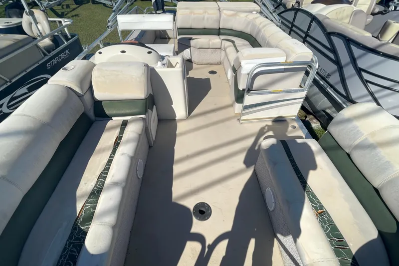 Slide: The Image of 2005 Avalon Paradise RF22 pontoon boat interior with spacious seating and open deck layout. - 5