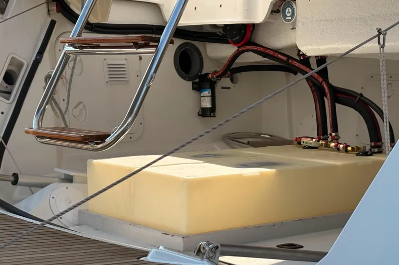 Slide: The Image of Engine compartment of a 2012 Jeanneau 57 yacht, featuring a ladder and fuel tank. - 10