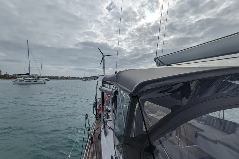 Slide: The Image of Sailing on a 2012 Jeanneau 57 yacht under cloudy skies, with other boats nearby. - 29