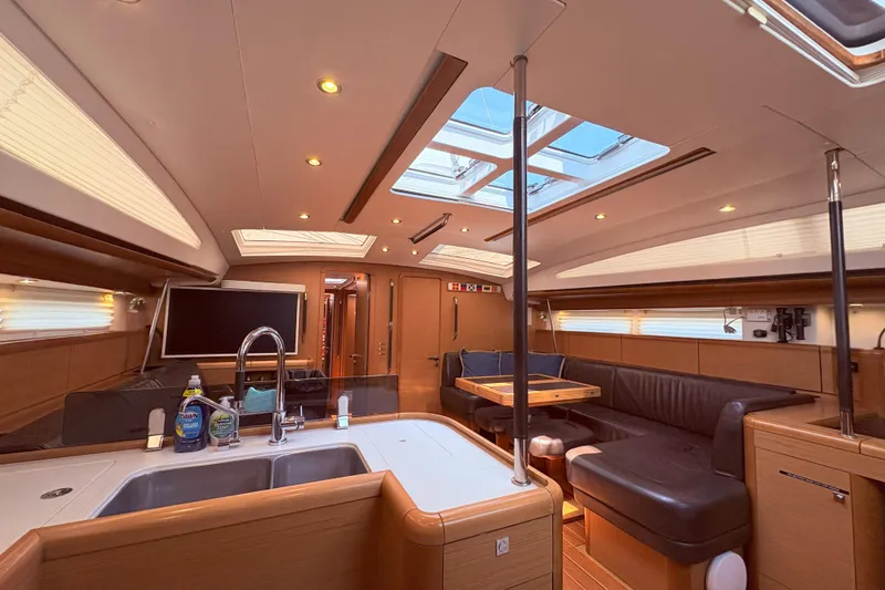 Slide: The Image of Luxurious interior of a 2012 Jeanneau 57 yacht with modern amenities and elegant design. - 50