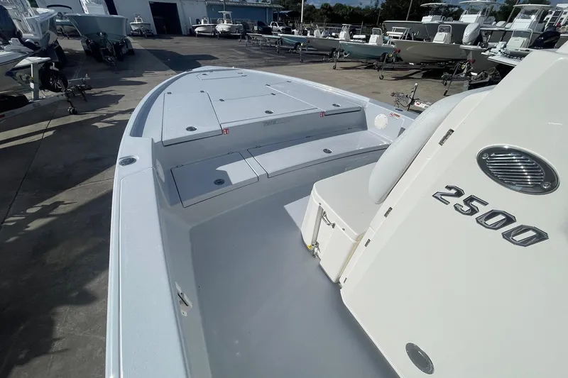 Slide: The Image of 2026 Pathfinder 2500 Hybrid boat displayed in a marina, showcasing sleek design and spacious deck. - 10