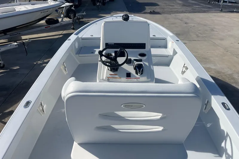 Slide: The Image of 2026 Pathfinder 2500 Hybrid boat interior with steering console and seating. - 17