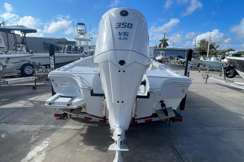 Slide: The Image of 2026 Pathfinder 2500 Hybrid boat with 350 V6 engine in a marina setting. - 4