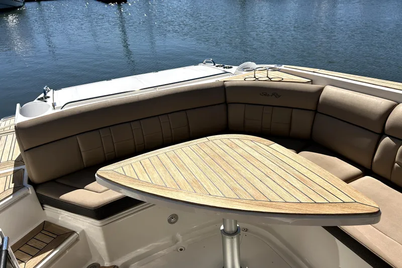 Slide: The Image of Luxurious 2016 Sea Ray 350 SLX boat interior with elegant seating and wooden table. - 2