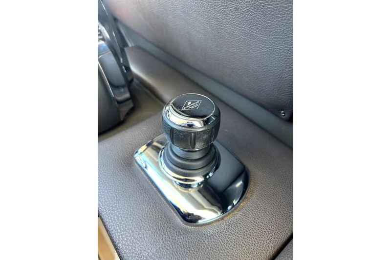 Slide: The Image of Close-up of joystick control in 2016 Sea Ray 350 SLX boat interior. - 8