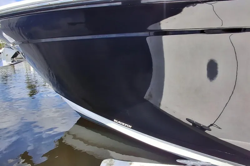 Slide: The Image of 2023 Blackfin 272DC boat hull reflecting on water. - 19
