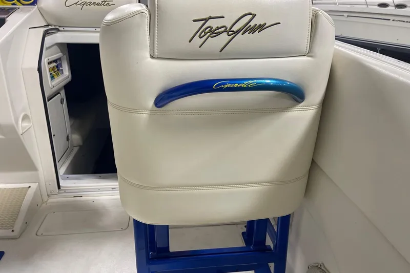Slide: The Image of 2002 Cigarette 38 Top Gun boat interior with branded seat and blue handle. - 19