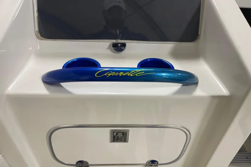 Slide: The Image of 2002 Cigarette 38 Top Gun boat dashboard with blue accents and logo. - 28