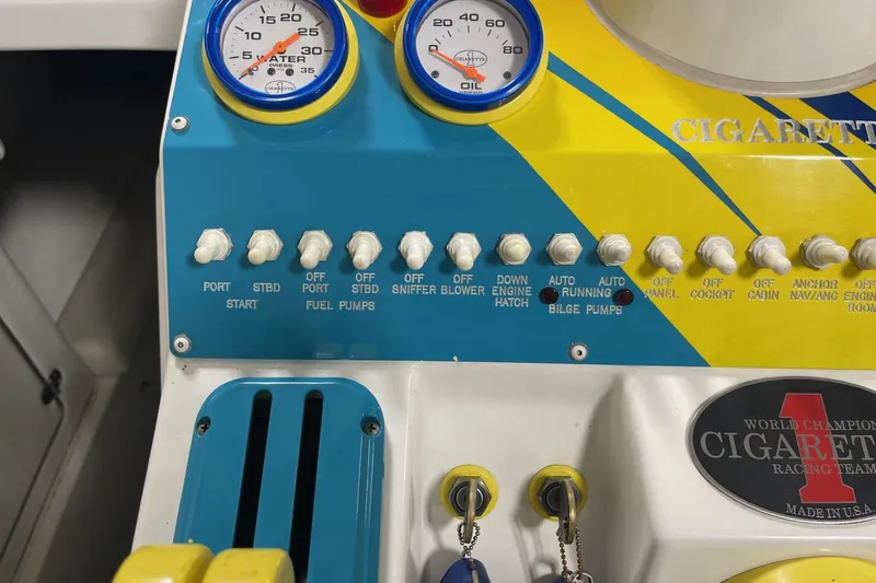 Slide: The Image of Control panel of a 2002 Cigarette 38 Top Gun boat with gauges and switches. - 34